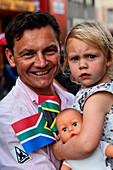 Father and daughter celebrating the Football world cup final draw, 04.12.2009, fans celebrate the drawing of the first round, Long street, Capetown, Western Cape, South Africa, Africa