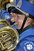 High School Band Member plays french horn at Strawberry Festival Parade Plant City Florida