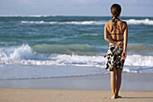 Woman standing on the beach  Maui,  Hawaii  Model released