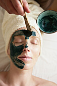 Green clay face skin theraphy massage,  woman