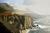 FOG AND DARK CLOUDS ROLL INTO HURRICANE POINT AT THE BIG SUR COASTLINE ALONG THE PACIFIC OCEAN,  CALIFORNIA