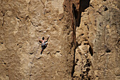 A rock climber tests his skills on the cliffs at Smith Rock State Park,  Oregon