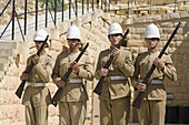 Four soldiers holding their rifles,  Fort Rinella,  Kalkara,  Malta