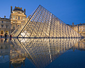 The new entrance to the Musee du Louvre,  a pyramidal,  glass structure designed by renowned American architect I M Pei  Paris,  France