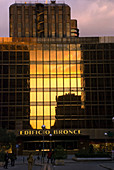 Sunset reflects on Edificio Bronce (´bronze building´),  making its name stand true,  Madrid. Spain