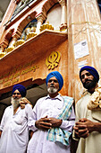 Sikh men standing in front of Gurdwara Shri Guru Nanak Dev Ji Manikaren,  Himachal Pradesh,  India