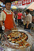 Sausage vender in an outdoor market Seoul,  South Korea