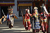 Masked monks dancing during a festival at Lama Yuru monastery Ladakh,  India
