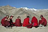 A group of novice monks sitting outside of the monastery Lama Yuru,  Ladakh,  India