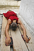 Prostrating Monk at Boudhanath Stupa Kathmandu,  Nepal