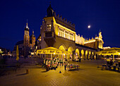 Krakow Poland Cloth Hall  Sukiennice  flowers stall and St Mary´s  Mariacki  Church at Main Market Square  Rynek Glowny  at night