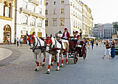Poland Krakow,  Main Market Square,  carriage women drivers