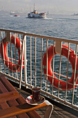 Ferry, passenger boat, life buoy, glass of tea, Golden Horn, Istanbul, Turkey