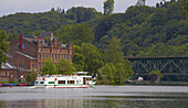 River Ruhr (Kettwiger Lake) with boats, pubs and former Scheidtsche Tuchfabrik at Essen-Kettwig, Ruhrgebiet, North Rhine-Westphalia, Germany, Europe