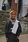 Smiling girl with local dress in a village, Uttarakhand, India, Asia
