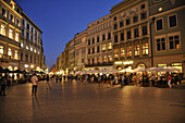 Rynek glowny, market place with street cafes in the evening, Krakow, Poland, Europe