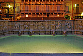 Illuminated fountain with coins in the evening, Piazza del Campo, Siena, Tuscany, Italy, Europe