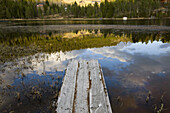 Reflections of clouds and jetty at a lake, Norway, Scandinavia, Europe