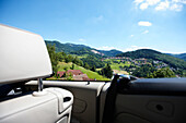 View from a convertible over Ottenhoefen, Black Forest, Baden-Wuerttemberg, Germany