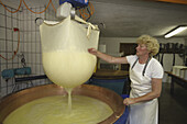 Producing cheese at the Laufbichl Alpe alpine dairy, Hintersteiner Tal, Bad Hindelang, Allgau, Swabia, Bavaria, Germany