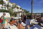 Vacationers in Buddha Beach Club, Puerto Banus, Marbella, Andalusia, Spain