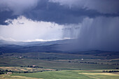 view from the western city wall on to an approaching thunderstorm, Pienza, Tuscany, Italy