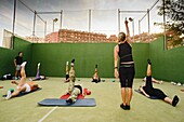 Adult, Class, Concentration, Exercise, Group, Human, Instructor, Men, Outdoors, Pilates, Stretching, Teacher, Trainer, Training, Woman, Women, A75-970230, agefotostock 