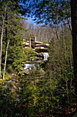 Upstream exterior view of Fallingwater  Also known as the Edgar J  Kaufmann Sr  Residence, Fallingwater was designed by American architect Frank Lloyd Wright in 1934 in rural southwestern Pennsylvania, 50 miles southeast of Pittsburgh  The house was built