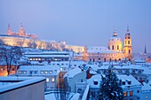 prague - hradcany castle and st  nicolaus church in winter