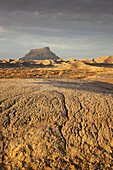 Factory Butte at sunset in winter, Caineville, Utah, USA