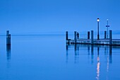 Italy, Veneto, Lake District, Lake Garda, Garda, lakeside pier view, dawn
