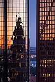 USA, Massachusetts, Boston, Financial District, Customs House Tower reflected in Exchange Place, dawn