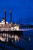 USA, Mississippi, Natchez, Isle of Capri Casino riverboat on Mississippi River, dusk