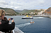 Tourists on the ferry photographing San Sebastian, Gomera, Canary Isles, Spain, Europe