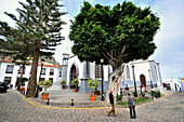 People in front of a church, San Marcos, Agulo, north coast of Gomera, Canary Isles, Spain, Europe