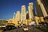 People in street cafes and high rise buildings under blue sky, Jumeirah Beach Residence, Dubai, UAE, United Arab Emirates, Middle East, Asia