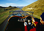 Driving along the Summit Road Port Hills Christchurch New Zealand