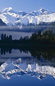 Mt Tasman left and Aoraki / Mt Cook reflection Lake Matheson Westland National Park New Zealand