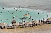View at people on the beach and in the dead sea, En Bokek, Israel, Middle East