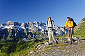 Two women hiking on the GR 5 Trek, Portes de l'Hiver, Val d'Illiez, Dents Blanches in background, Valais, Switzerland