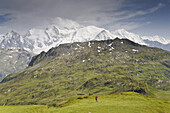 Woman hiking at Col d'Anterne, Mont Blanc in background, Rhone-Alpes, France