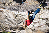 Man climbing on granite rock, Stubaital, Tyrol, Austria