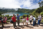 Tourists at crater lake, Laguna Botos, Poas National Park, Costa Rica, Central America