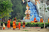 Young monks at Wat Thavron Wararam temple in Kanchanaburi at River Kwai, Thailand, Asia