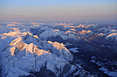 Alpspitze, Jubilaeumsgrat and Zugspitze at sunrise, Lechtal range, Allgaeu range and Ammergau range in background, aerial photo, Bavarian alps, Upper Bavaria, Bavaria, Germany, Europe