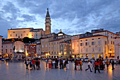 People on a square in the evening, Piran, Slovenia, Europe