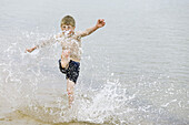 Boy is playing in the water