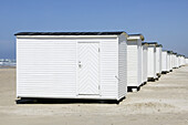White bathing huts on the beach, Jutland, Denmark