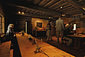 People in a restaurant in an old wooden house, Estonian open air museum, Tallinn, Estonia, Europe