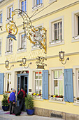 Guests entering hotel, Rothenburg ob der Tauber, Bavaria, Germany
